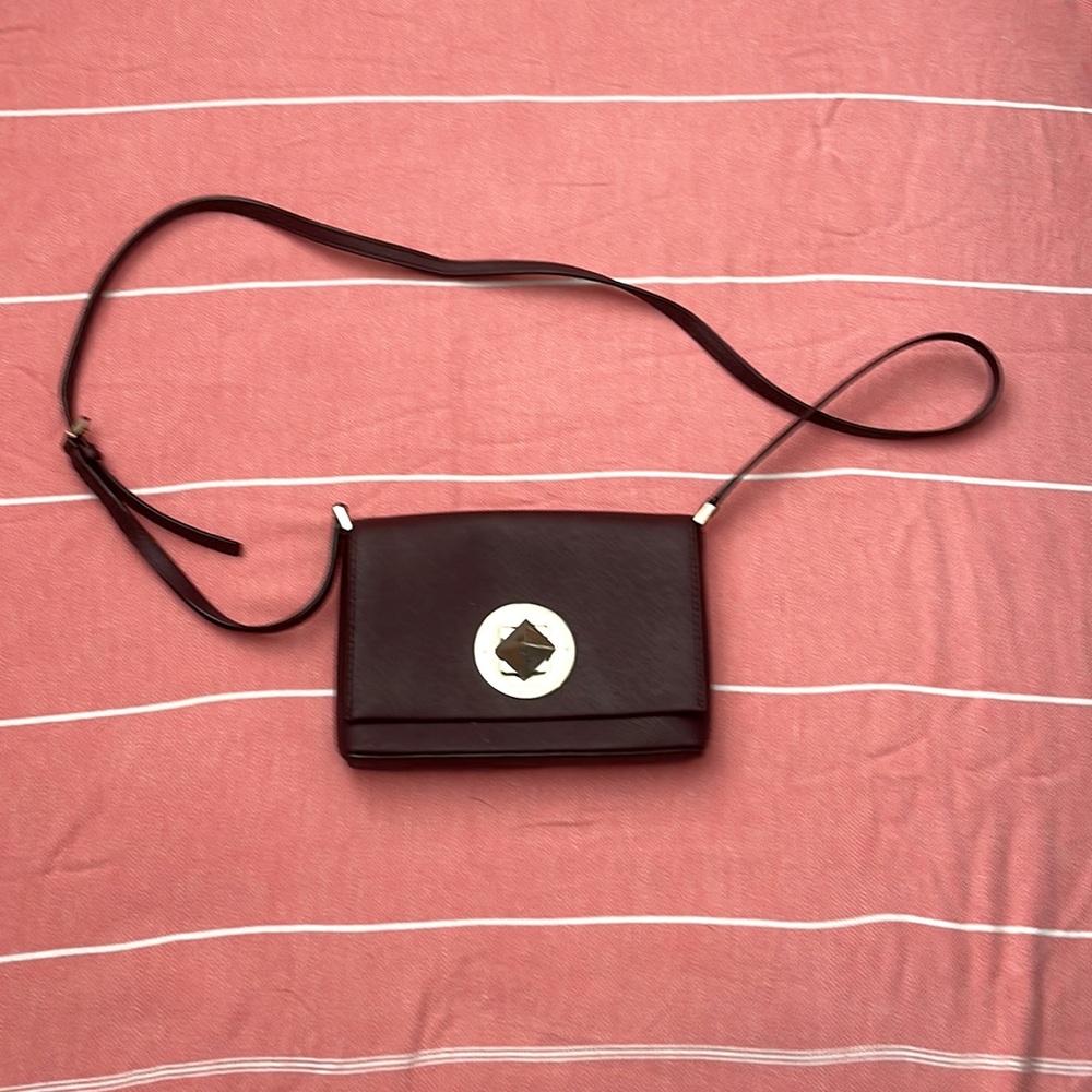 Kate spade Crossbody Newish condition deep burgundy to brown with gold accents